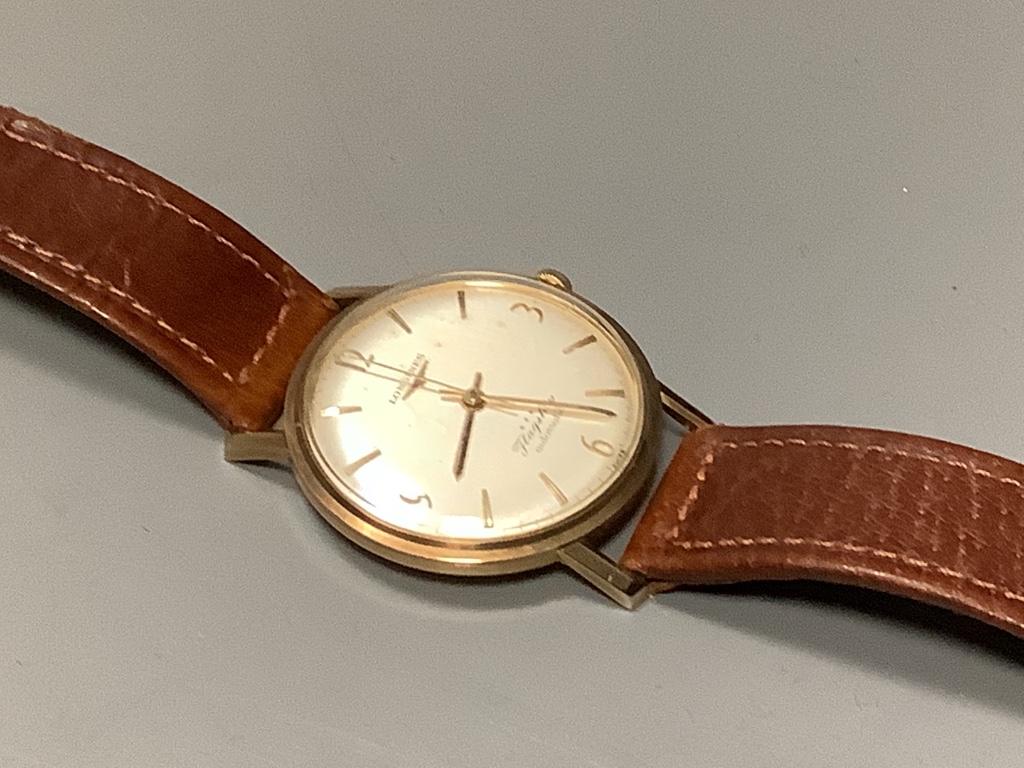 A gentleman's 9ct gold Longines Flagship automatic wristwatch, on a leather strap, with Longines box, case diameter 36mm, excluding crown, gross 36.8 grams.